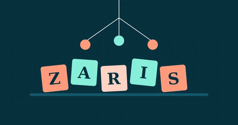 Wooden-style letter blocks spelling Zaris under a hanging baby mobile